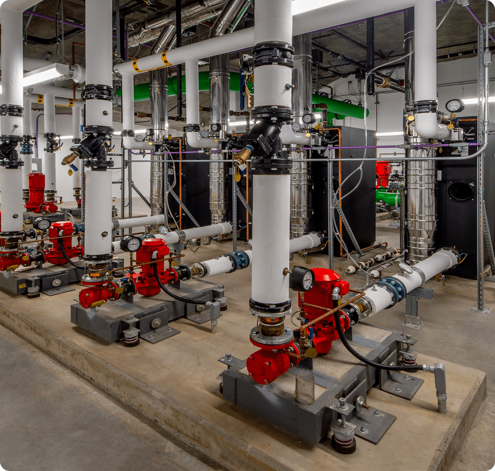 Industrial piping system with red valves.